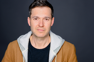 Nathan Peterson headshot, warm jacket